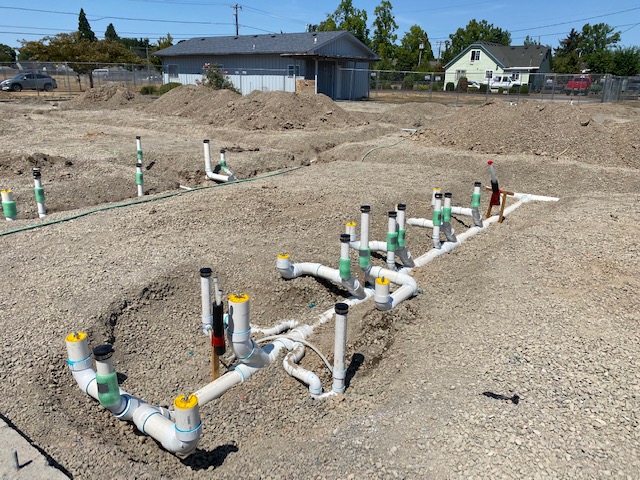 Plumbing for new construction in ground, before the foundation is set.