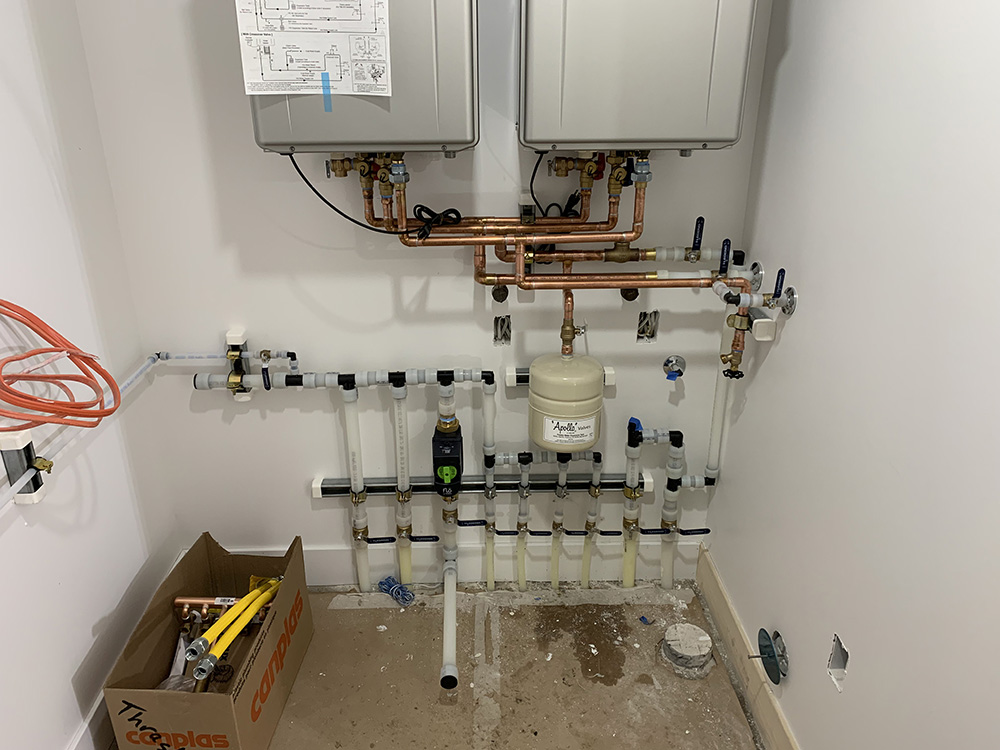many new water lines in a maintenance closet installed professionally with many valves